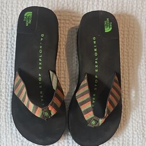 The North Face Kids Black and Orange Flip Flops